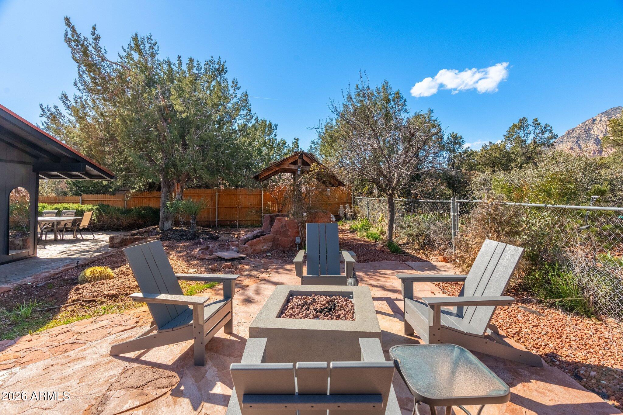 40 Mission Road Sedona, AZ 86336 - Photo 56 of 75 a view of a patio with table and chairs and potted plants
