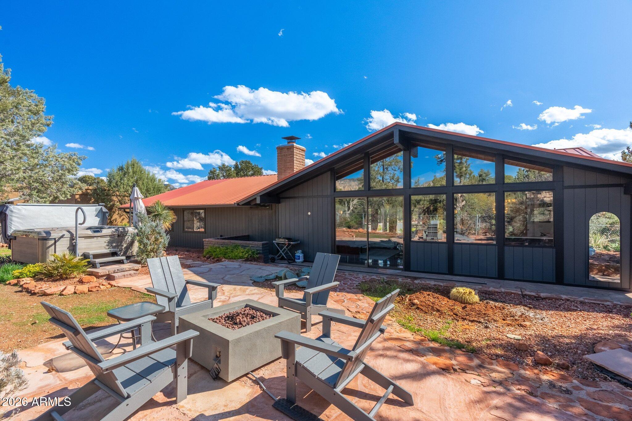 40 Mission Road Sedona, AZ 86336 - Photo 57 of 75 a view of a house with backyard porch and sitting area