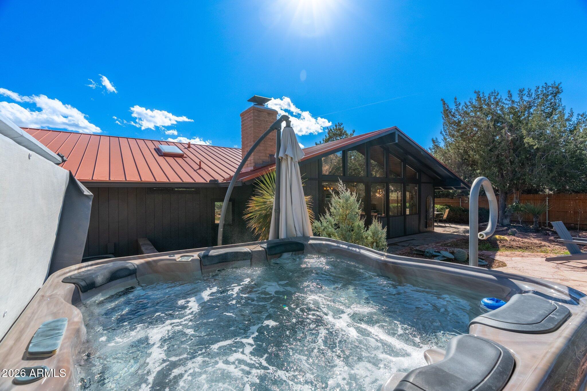 40 Mission Road Sedona, AZ 86336 - Photo 59 of 75 a view of a house with backyard and sitting area