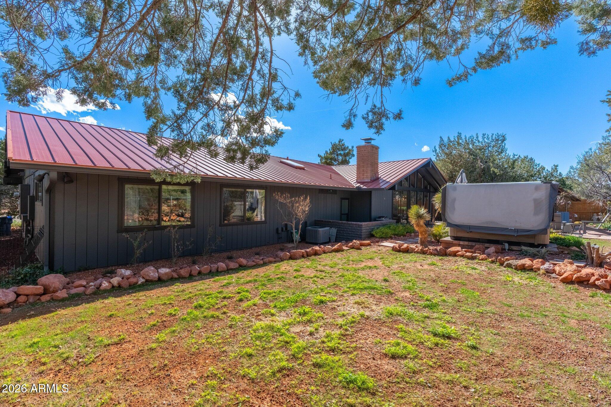 40 Mission Road Sedona, AZ 86336 - Photo 60 of 75 a front view of a house with a yard