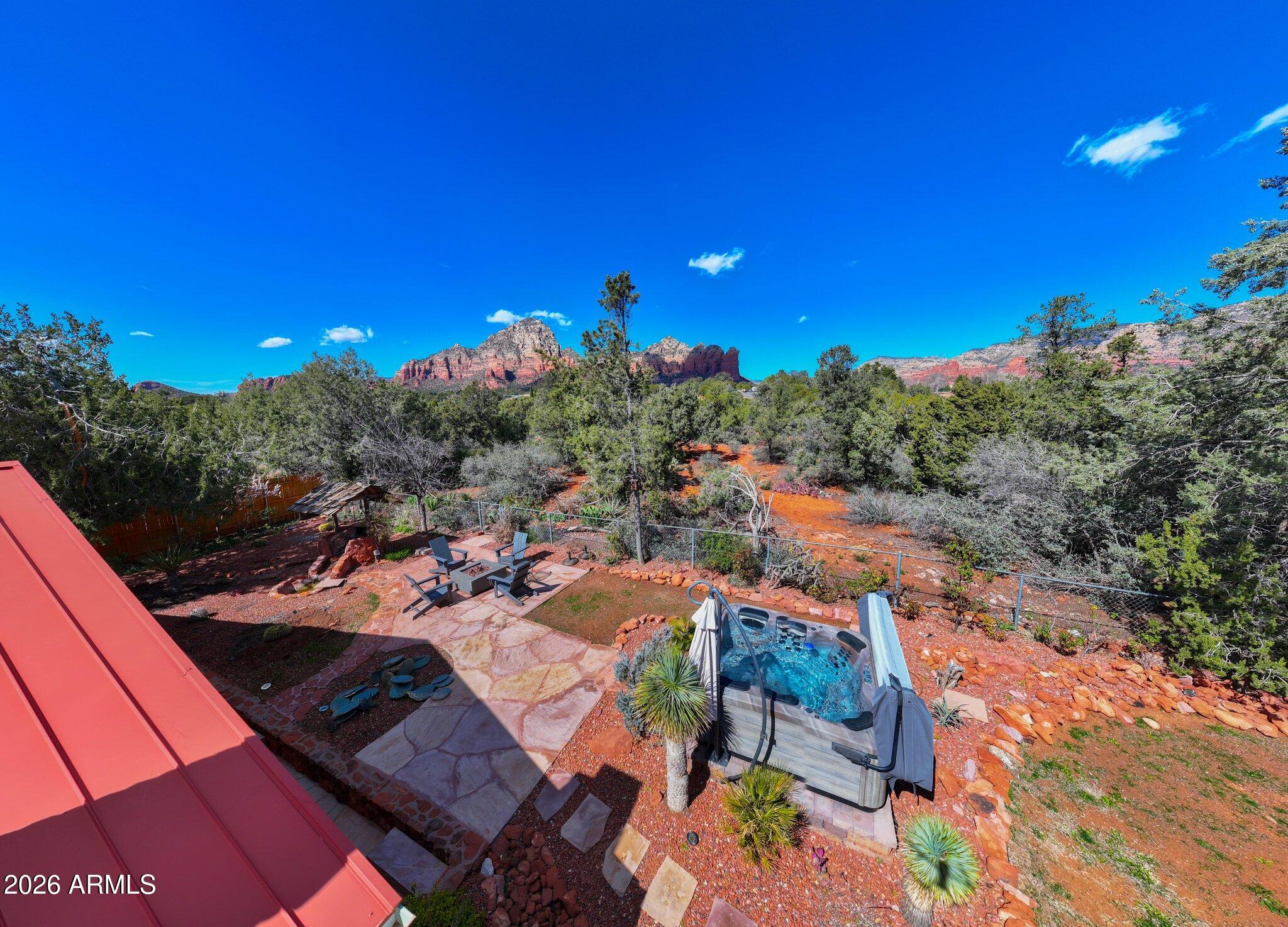 40 Mission Road Sedona, AZ 86336 - Photo 64 of 75 a view of a patio with swimming pool and sitting area