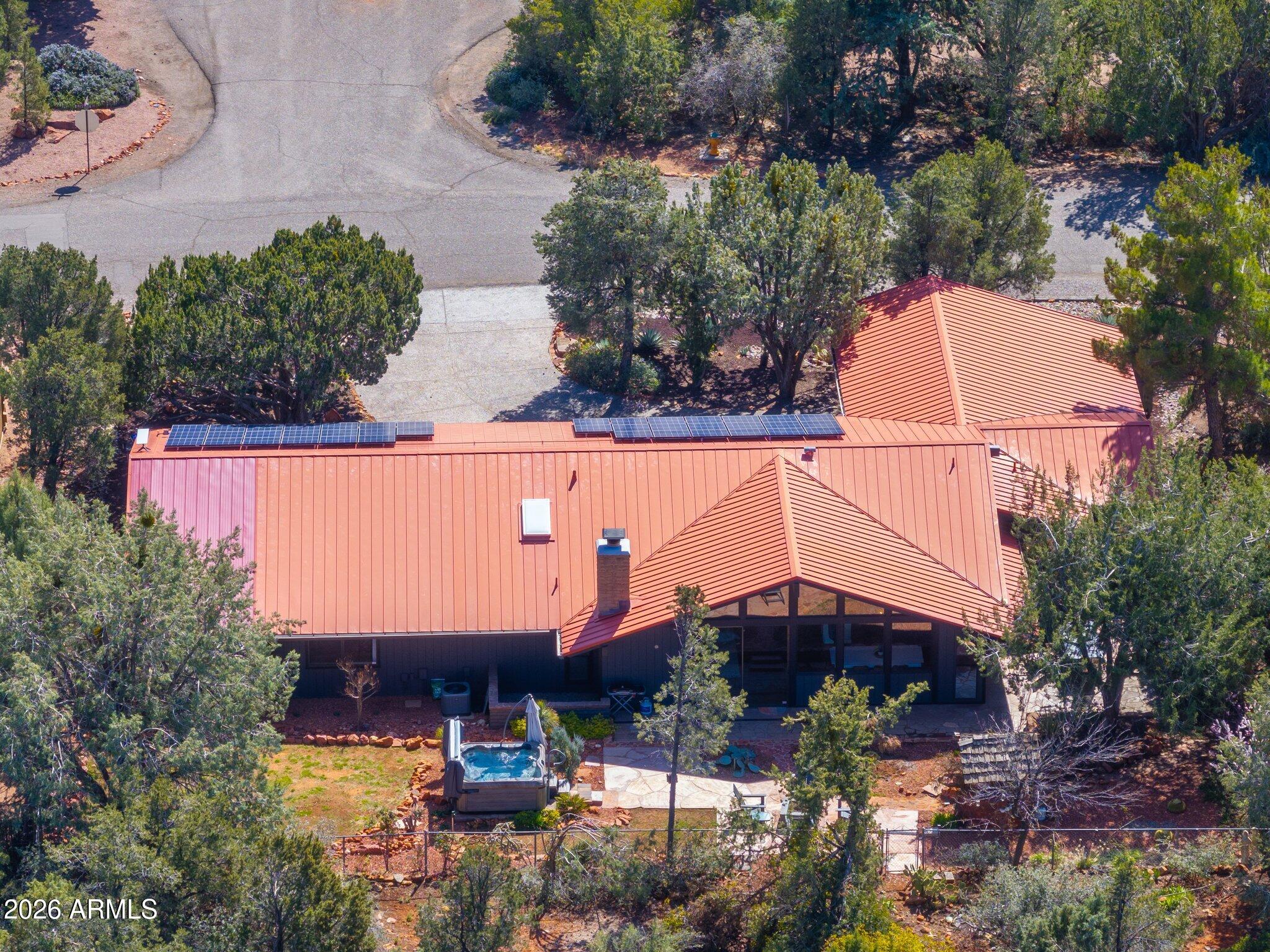 40 Mission Road Sedona, AZ 86336 - Photo 72 of 75 an aerial view of a house with a garden and lake view