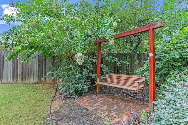 a view of a house with a small deck