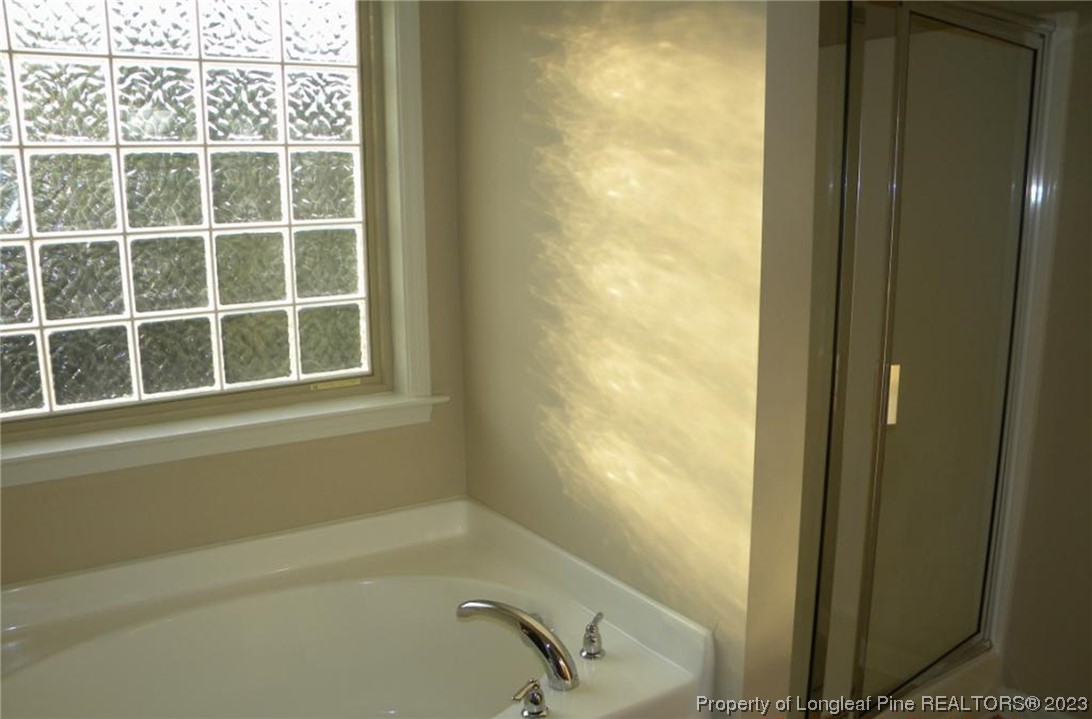 93 Expedition Drive Cameron, NC 28326 - Photo 11 of 19 a bathroom with a bathtub