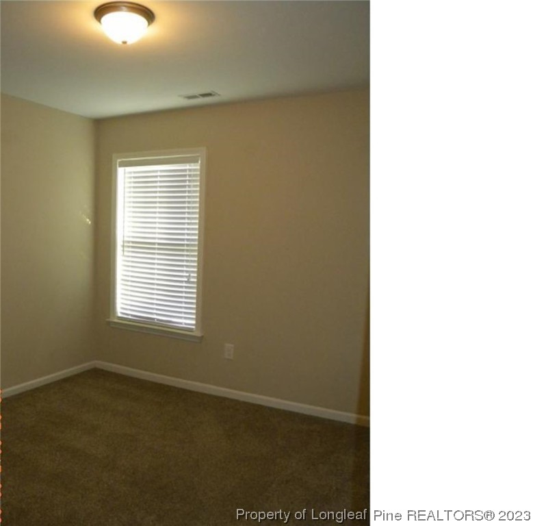 93 Expedition Drive Cameron, NC 28326 - Photo 13 of 19 a view of an empty room with a window
