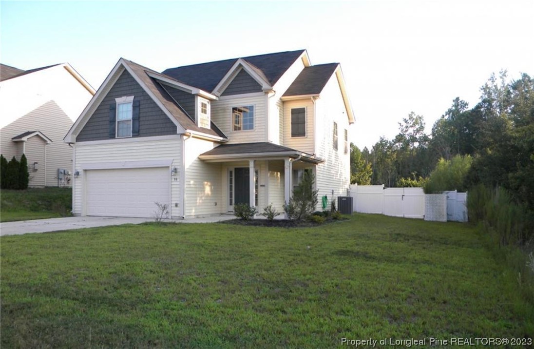 93 Expedition Drive Cameron, NC 28326 - Photo 2 of 19 a front view of a house with a yard