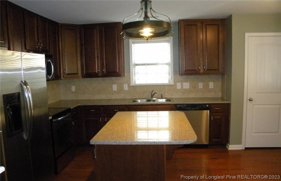 93 Expedition Drive Cameron, NC 28326 - Photo 5 of 19 a kitchen with a sink window and cabinets