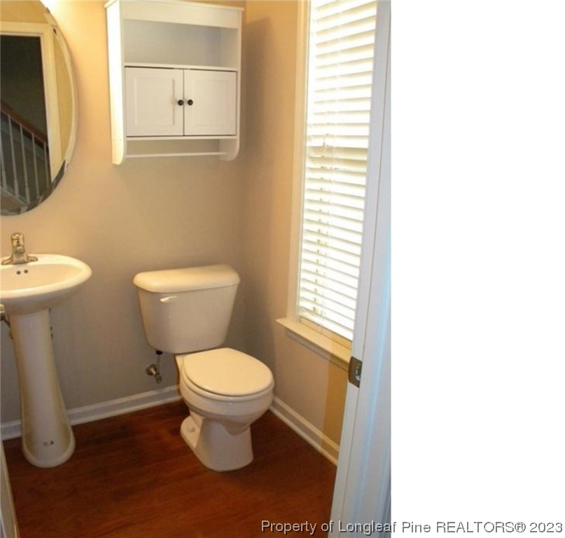 93 Expedition Drive Cameron, NC 28326 - Photo 7 of 19 a white toilet sitting next to a bathroom sink