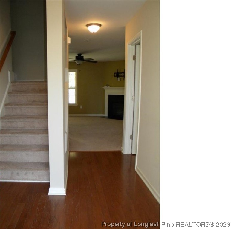 93 Expedition Drive Cameron, NC 28326 - Photo 8 of 19 a view of a hallway with wooden floor