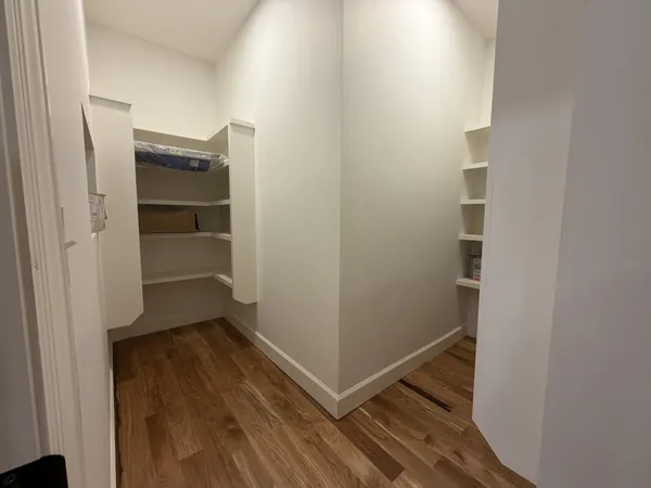 a view of an empty walk in closet