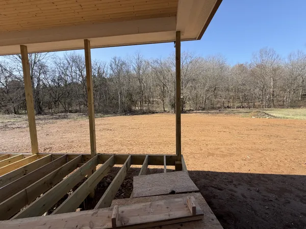 a view of a backyard with a ocean view