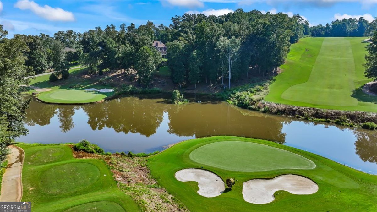 105 Birch Circle Forsyth, GA 31029 - Photo 8 of 12 a view of a swimming pool with a yard and outdoor seating