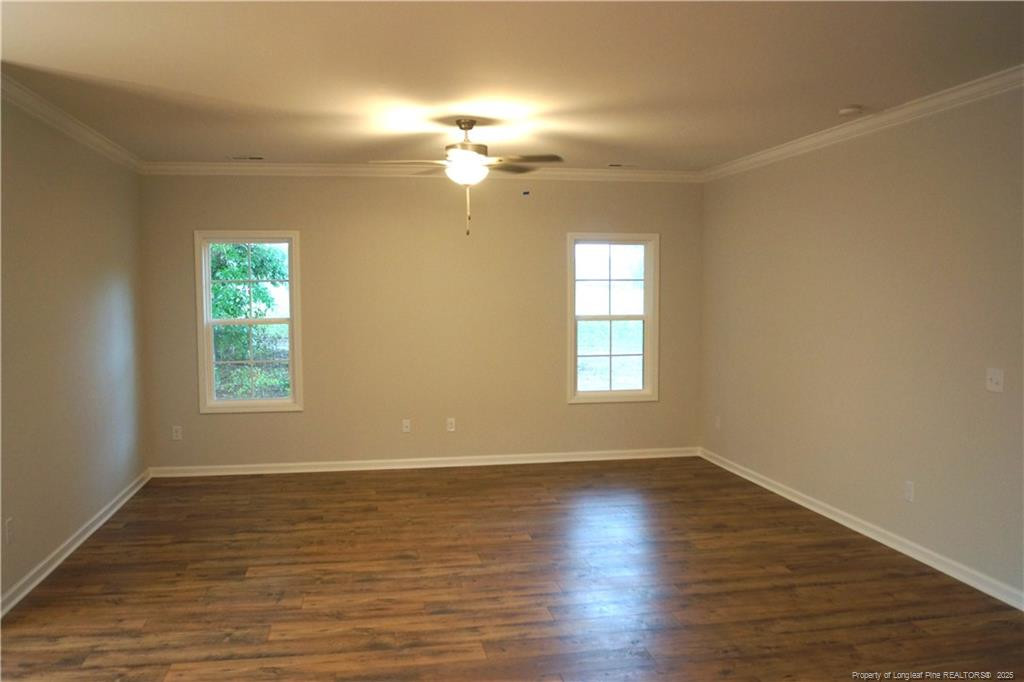 123 Nectar Lane Bunnlevel, NC 28323 - Photo 19 of 36 wooden floor in an empty room with a window