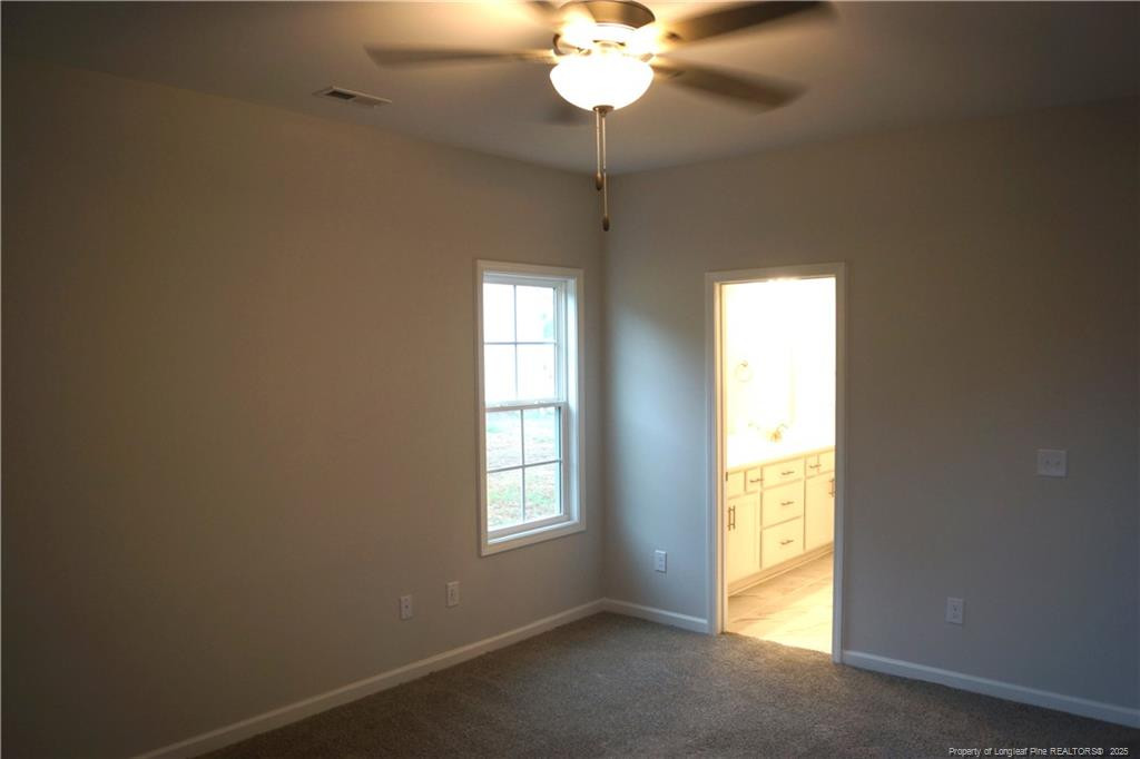 123 Nectar Lane Bunnlevel, NC 28323 - Photo 21 of 36 a view of an empty room with a window