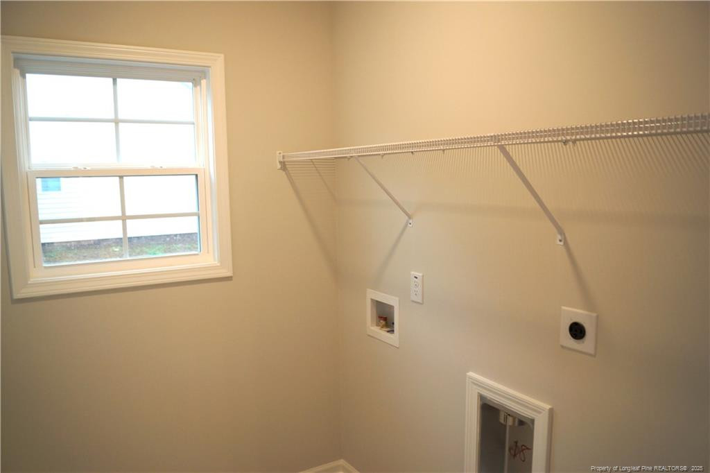 123 Nectar Lane Bunnlevel, NC 28323 - Photo 26 of 36 a bathroom with a window and a shower