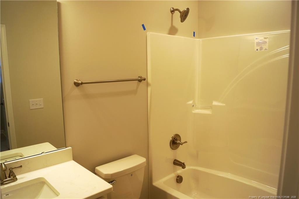 123 Nectar Lane Bunnlevel, NC 28323 - Photo 27 of 36 a bathroom with a shower a toilet and a sink