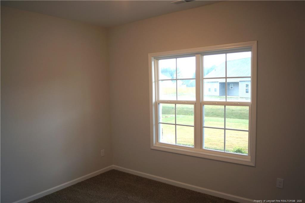 123 Nectar Lane Bunnlevel, NC 28323 - Photo 31 of 36 an empty room with a window