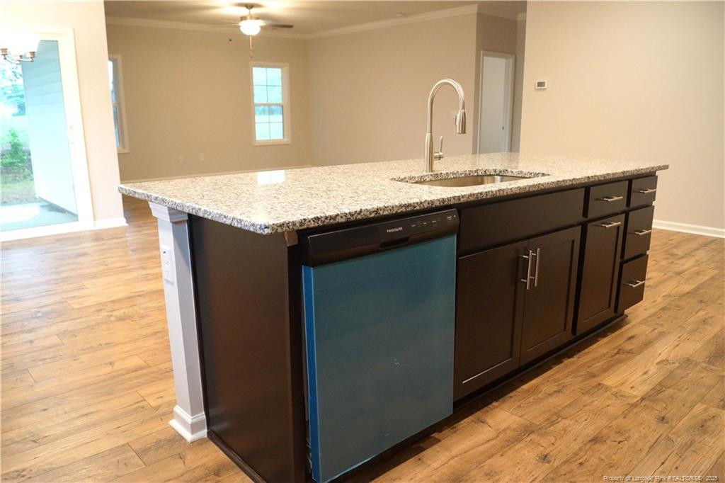 123 Nectar Lane Bunnlevel, NC 28323 - Photo 9 of 36 a bathroom with a granite countertop sink and a mirror