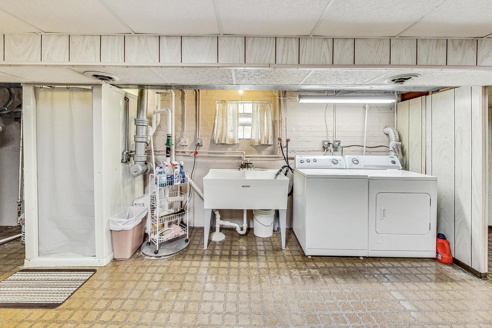 6241 South Rutherford Avenue Chicago, IL 60638 - Photo 23 of 39 a kitchen with a sink and cabinets