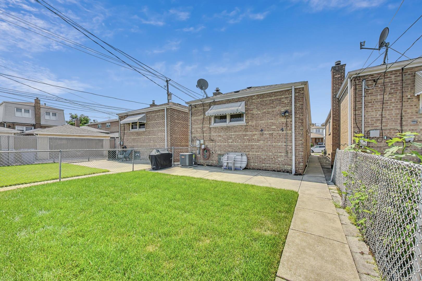 6241 South Rutherford Avenue Chicago, IL 60638 - Photo 30 of 39 a view of a backyard with a garden and plants