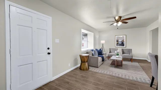 a living room with furniture and a window