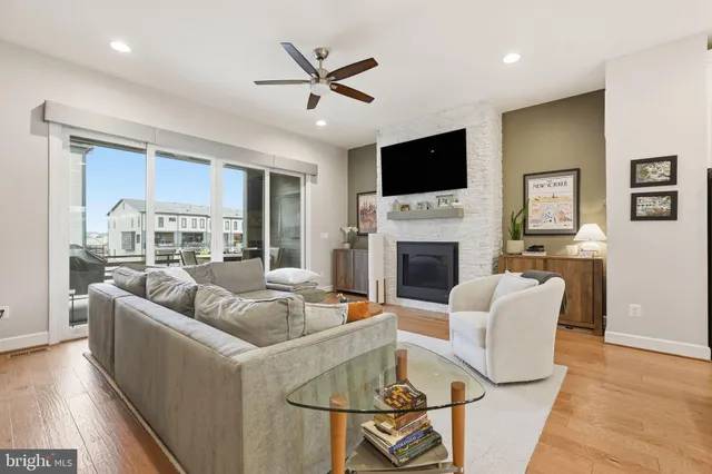 a living room with fireplace furniture and a flat screen tv