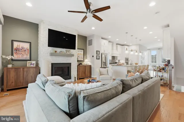 a living room with furniture fireplace and television