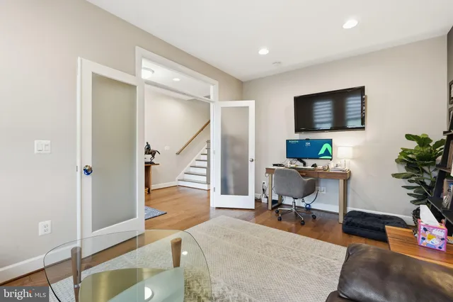 a workspace with furniture and a potted plant