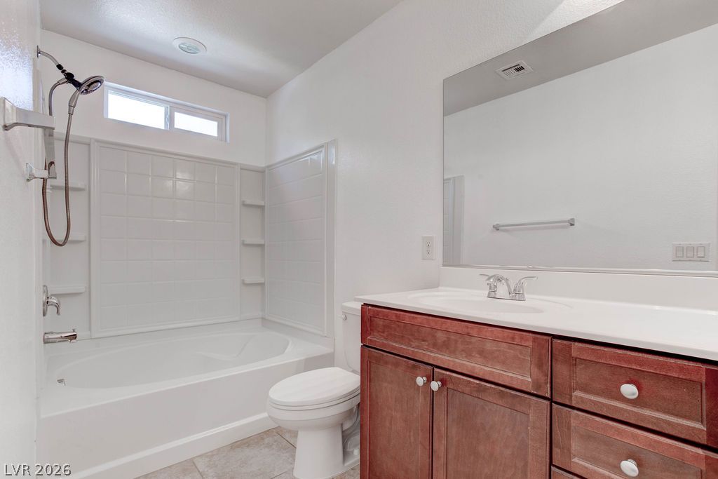 4650 Ranch House Road, Unit 47 North Las Vegas, NV 89031 - Photo 29 of 43 A pristine bathroom featuring a deep soaking tub, separate shower, and a practical vanity.