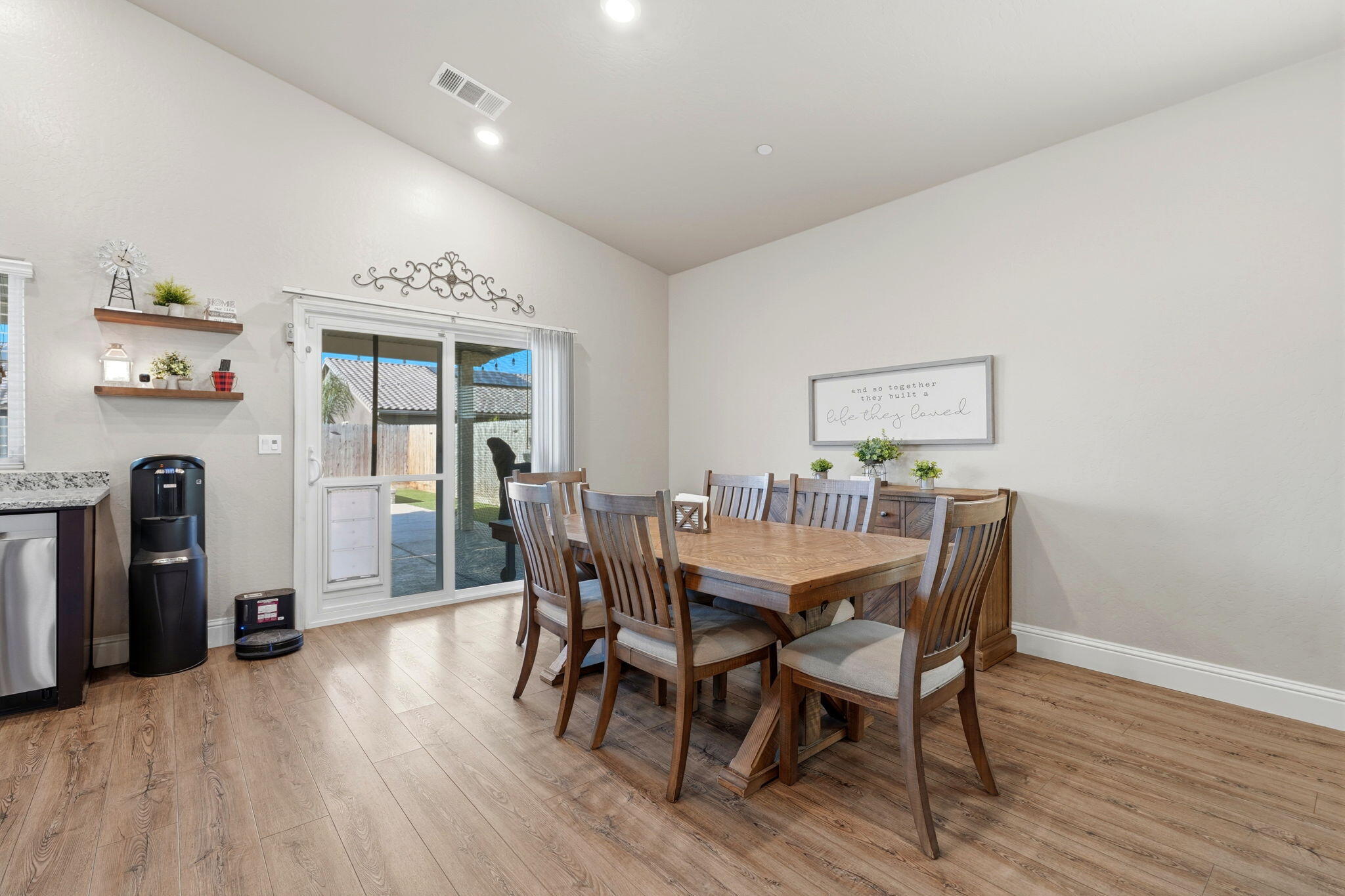 756 Strada Street Lemoore, CA 93245 - Photo 18 of 53 a view of a dining room with furniture and wooden floor