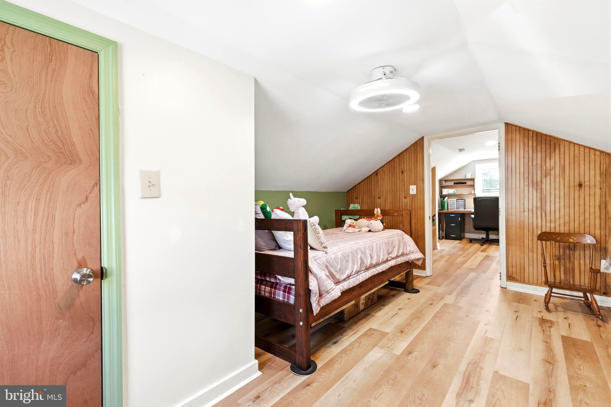 765 Old Manchester Road Westminster, MD 21157 - Photo 16 of 43 a bed room with a bed and a chandelier