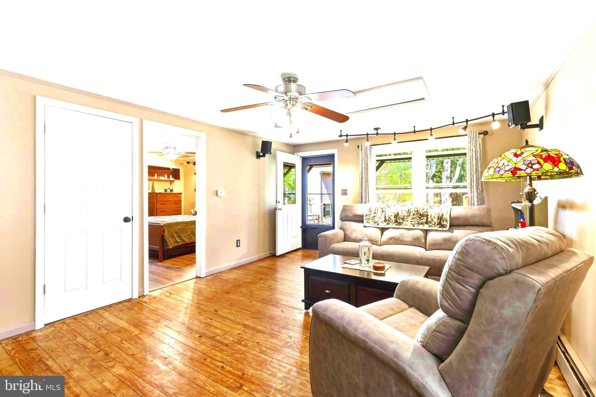 765 Old Manchester Road Westminster, MD 21157 - Photo 6 of 43 a living room with furniture and a large window