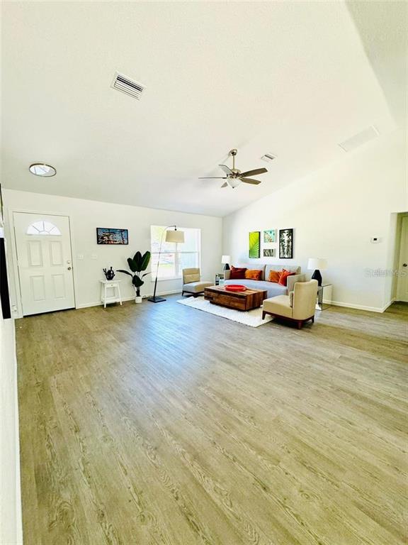 13731 Southwest 89 Circle Ocala, FL 34473 - Photo 12 of 24 a living room with furniture and a flat screen tv