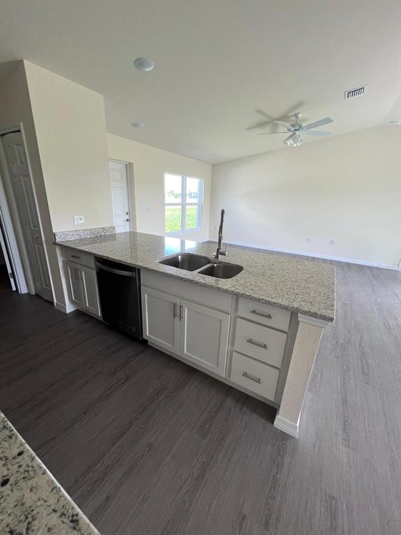 13731 Southwest 89 Circle Ocala, FL 34473 - Photo 12 of 34 a kitchen with a sink cabinets and wooden floor
