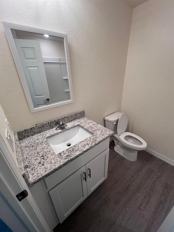 13731 Southwest 89 Circle Ocala, FL 34473 - Photo 14 of 34 a bathroom with a granite countertop sink and a mirror