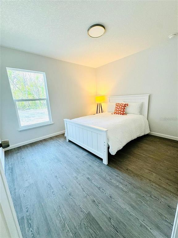 13731 Southwest 89 Circle Ocala, FL 34473 - Photo 14 of 24 a room with a bed and a window