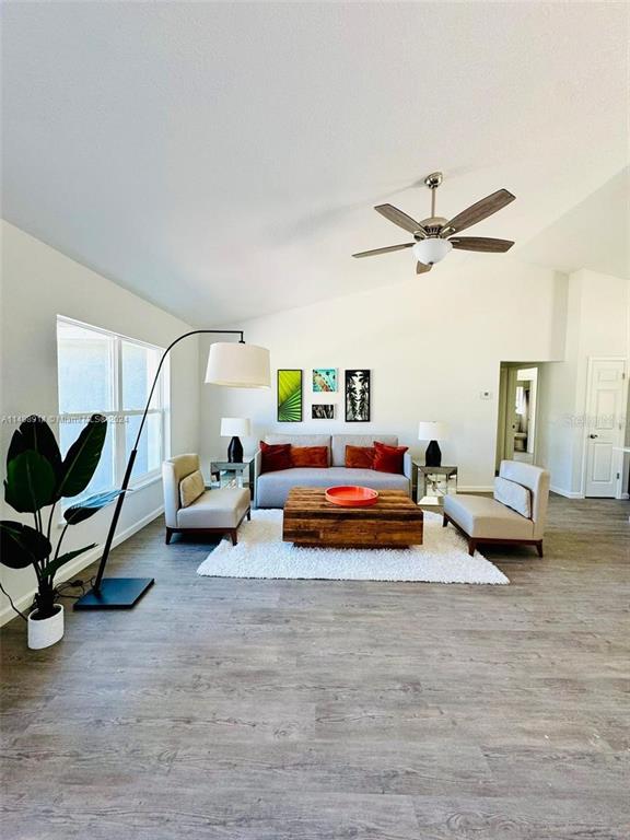 13731 Southwest 89 Circle Ocala, FL 34473 - Photo 16 of 34 a bedroom with furniture and a wooden floor