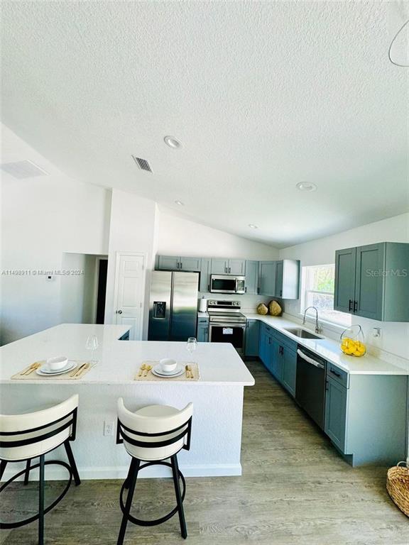 13731 Southwest 89 Circle Ocala, FL 34473 - Photo 21 of 34 a living room with stainless steel appliances kitchen island furniture and a window