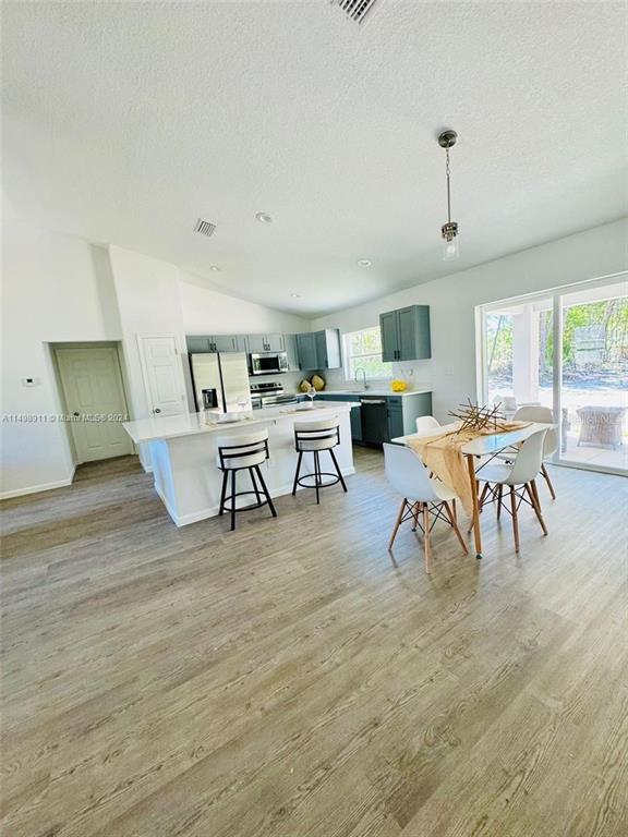 13731 Southwest 89 Circle Ocala, FL 34473 - Photo 26 of 34 a living room with furniture and a wooden floor