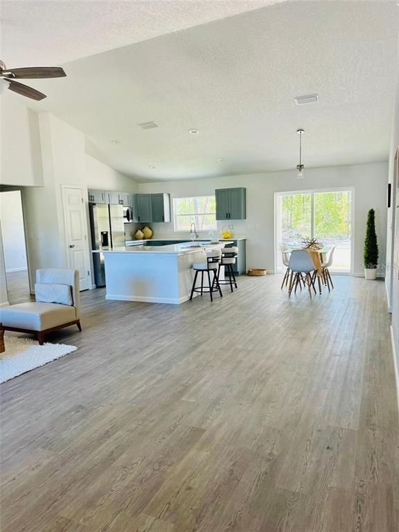 13731 Southwest 89 Circle Ocala, FL 34473 - Photo 4 of 24 a living room with furniture and a large window