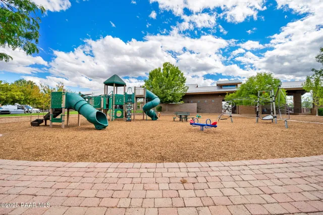 a view of a park with large trees