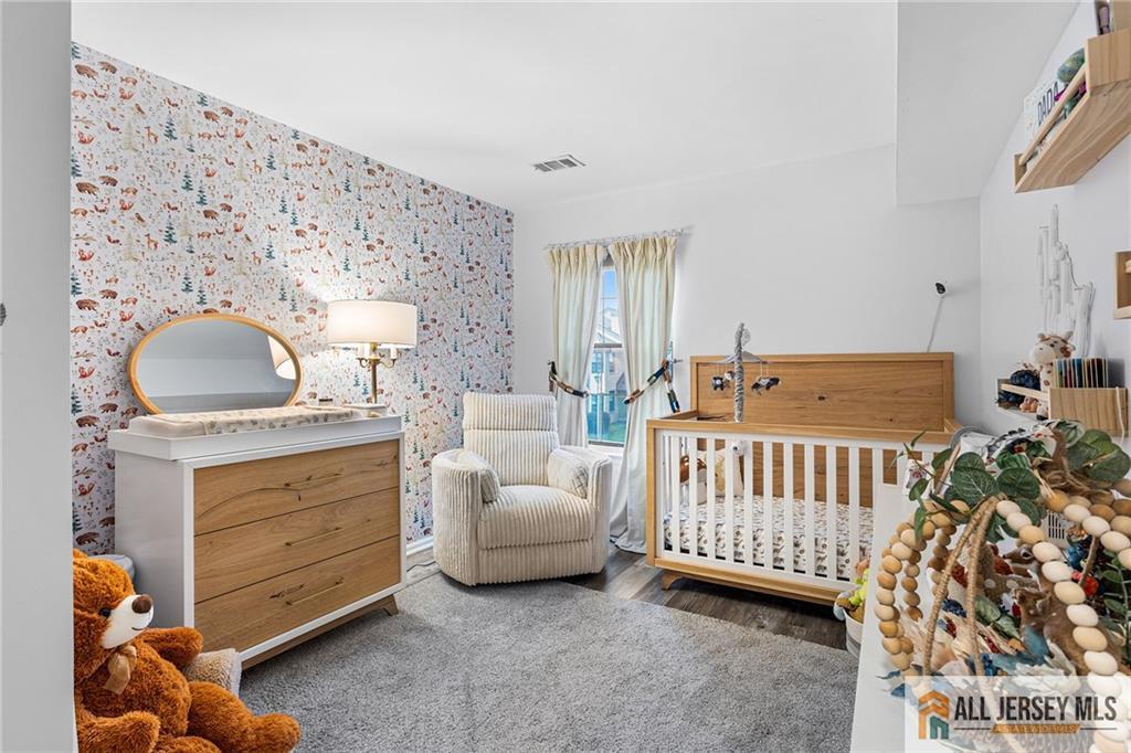 1511 Pebble Place, Unit 1511 Sayreville, NJ 08859 - Photo 12 of 26 a bedroom with a bed and a window