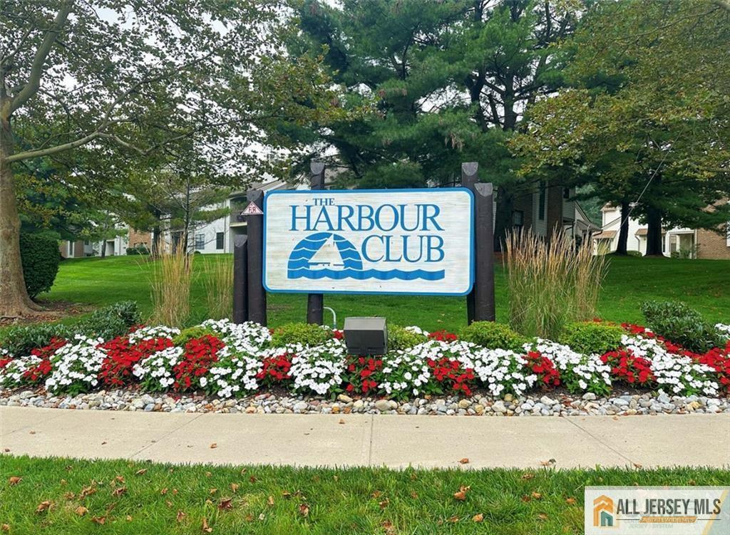 1511 Pebble Place, Unit 1511 Sayreville, NJ 08859 - Photo 26 of 26 a sign that is in front of flowers