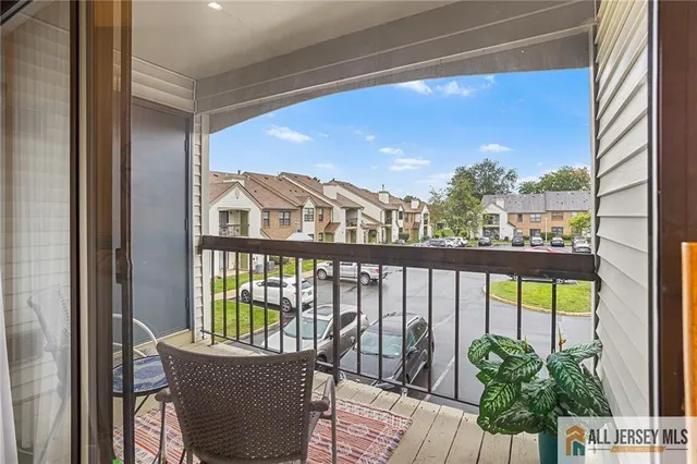 a view of a balcony with furniture