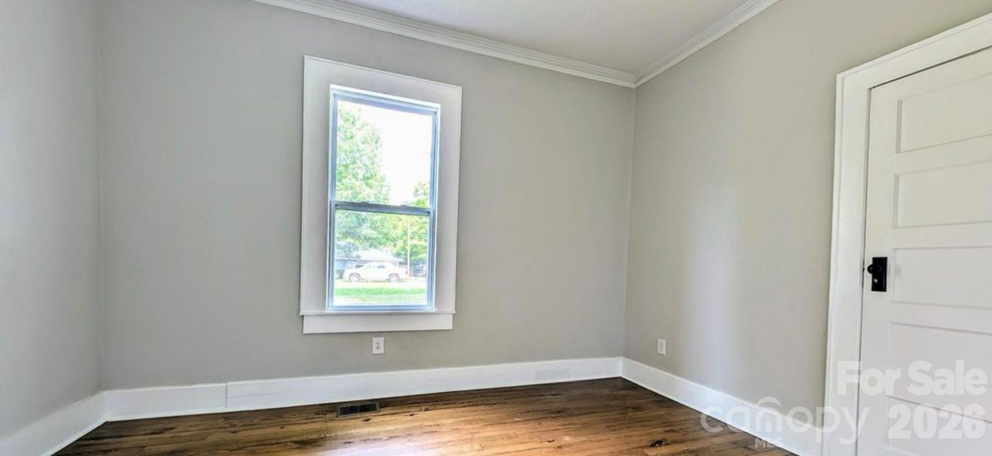 113 Brawley Street Chester, SC 29706 - Photo 4 of 12 a view of a room that has a window in it