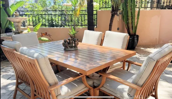 a view of a roof deck with furniture