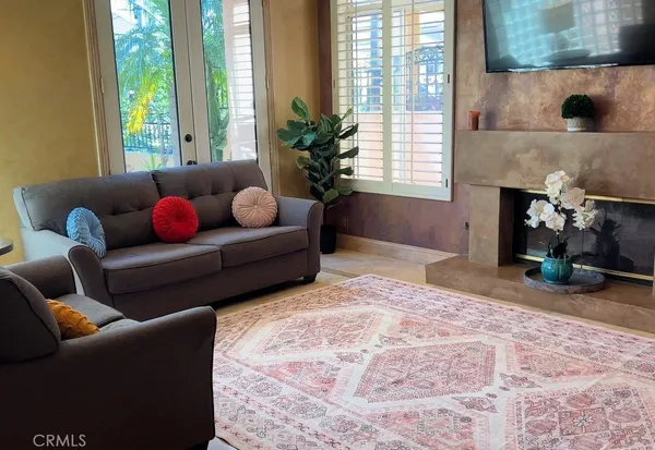 a living room with furniture and a fireplace