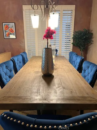 a room with furniture and a potted plant