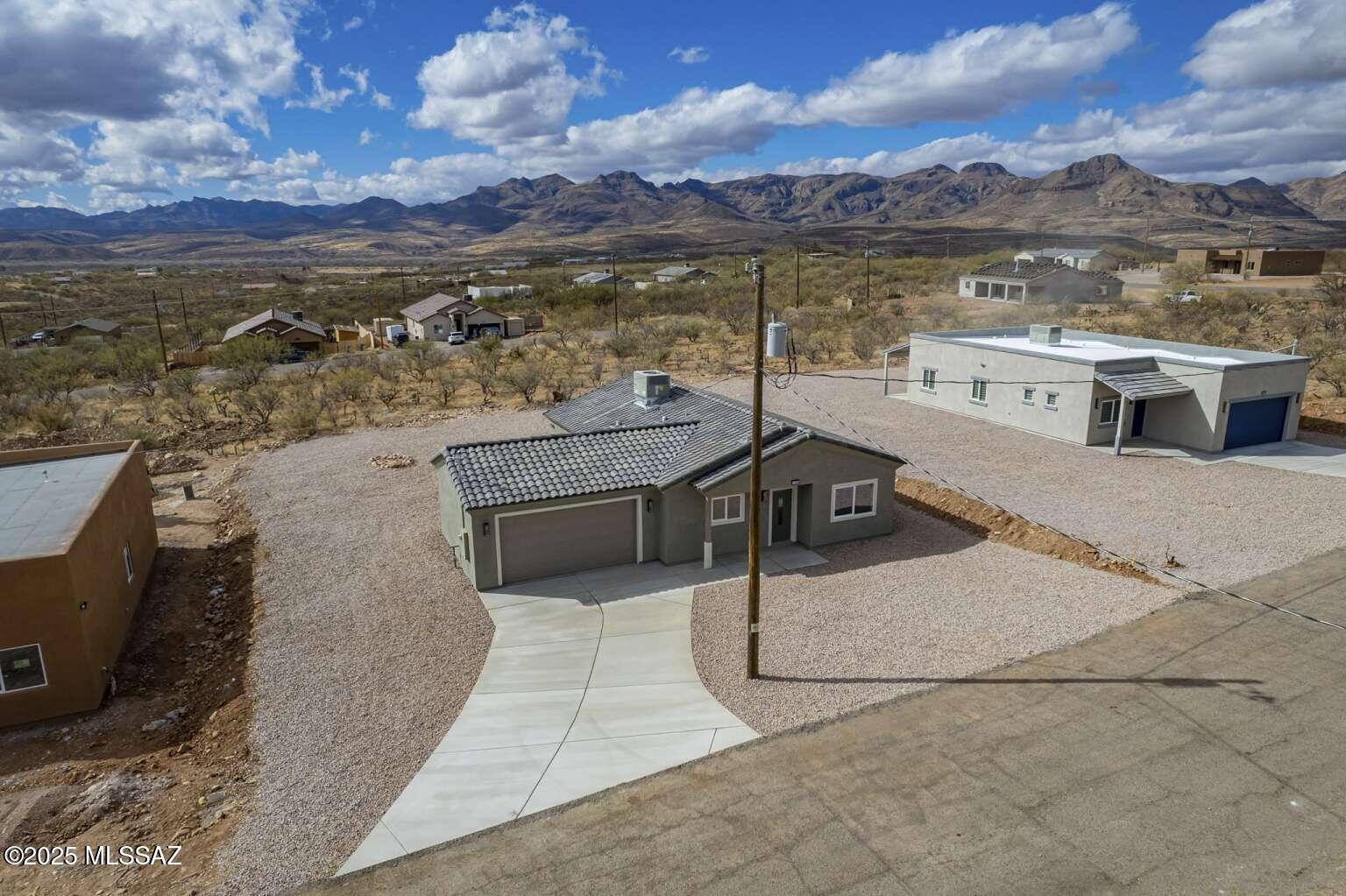 1796 Cajeme Court Rio Rico, AZ 85648 - Photo 43 of 45 a view of a terrace with lake view and mountain view