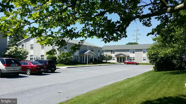 a view of a parked cars in front of a house